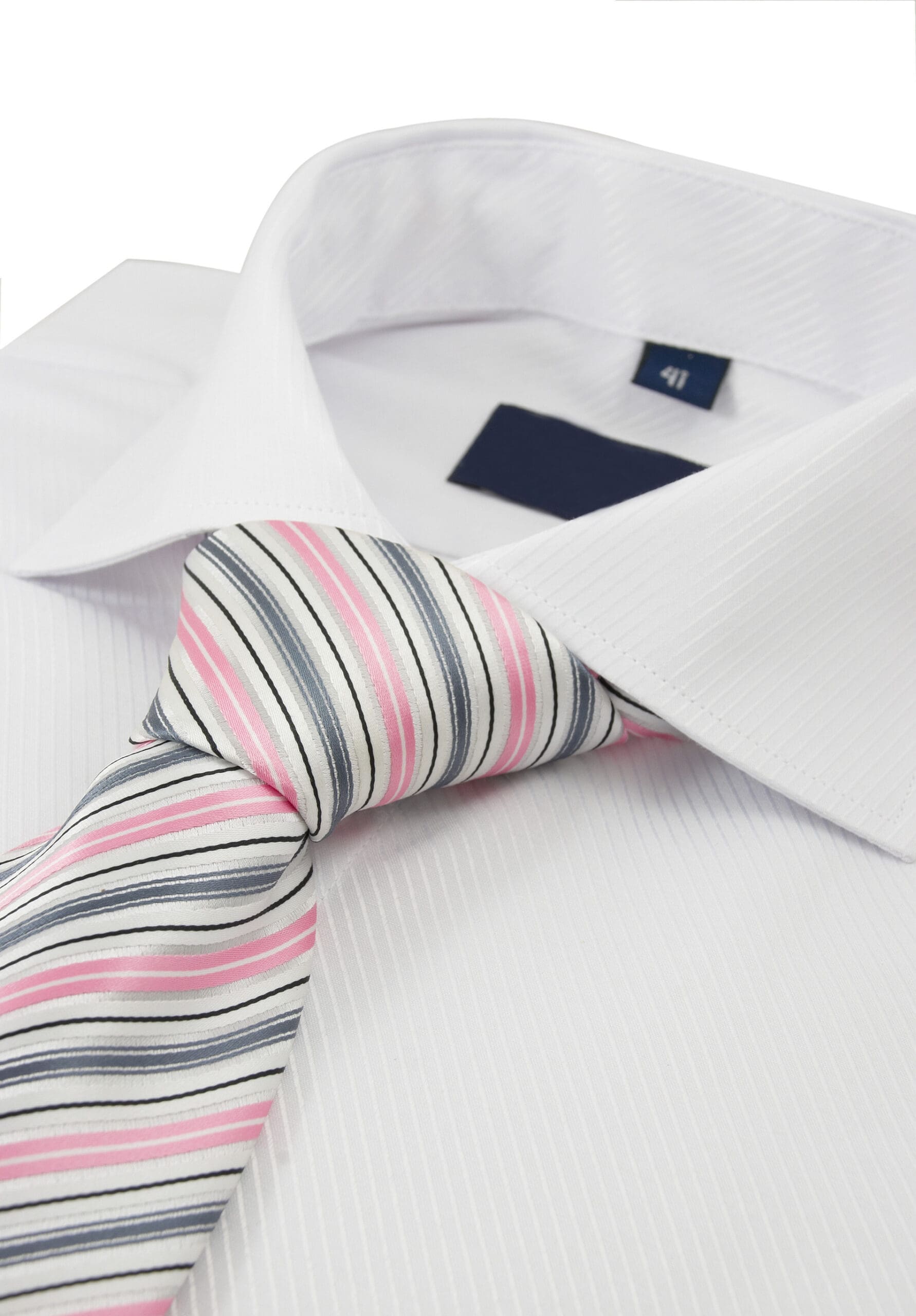Close-up of a white dress shirt with thin vertical stripes paired with a striped tie in shades of pink, white, and black.