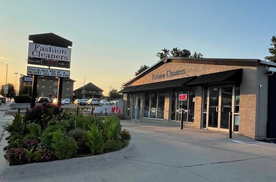 A dry cleaning business with a sign labeled 