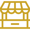 Fashion Cleaners Yellow line drawing of a market stall or shop with an awning and a counter, viewed from the front on a white background.